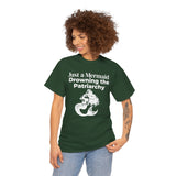 Curly-haired woman wearing a forest green Just a Mermaid Drowning the Patriarchy feminist T-shirt