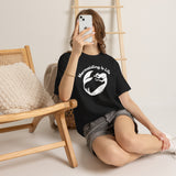 Woman sitting with phone wearing Mermaiding Is Life mermaid T-shirt