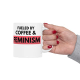 Woman holding Fueled by Coffee & Feminism white ceramic mug, 11 oz
